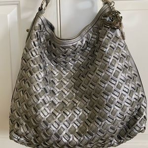 Metallic Silver patent leather shoulder bag.